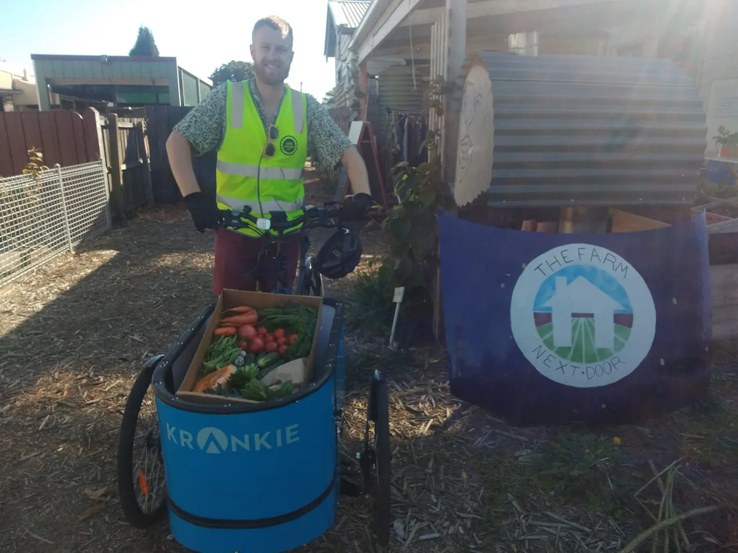 Tom on a cargo bike delivering fresh produce from The Farm Next Door